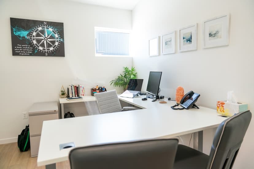 Modern office space with a desk, computer and decor. - Photo by Deliberate Directions on Unsplash