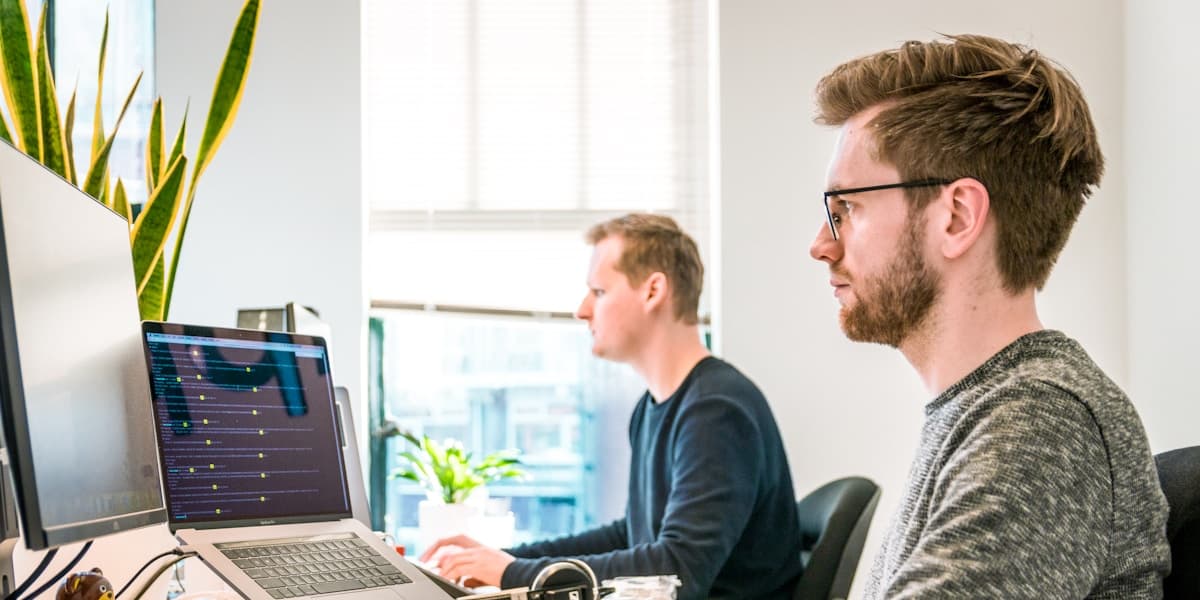 Professional team testing voice AI systems with advanced monitoring dashboards